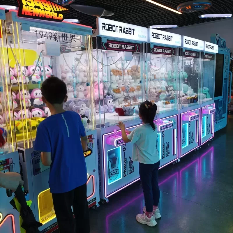 Commercial claw machine with colorful LED lighting for arcade businesses