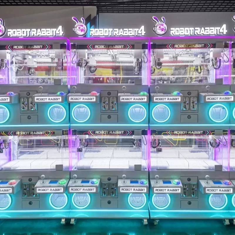 Colorful kids claw machine with plush toys for a family entertainment center