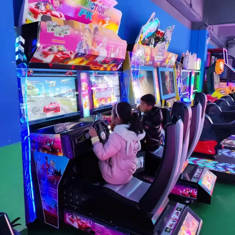 Modern arcade interior with neon lighting and claw machines