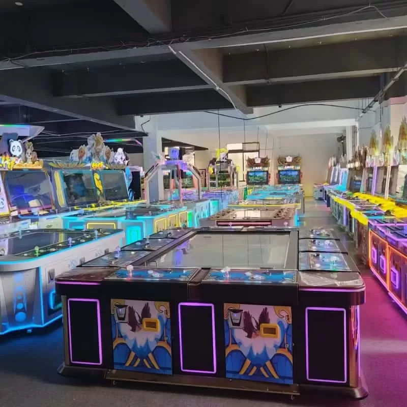 Arcade machine distributor inspecting a container of claw machines at a warehouse